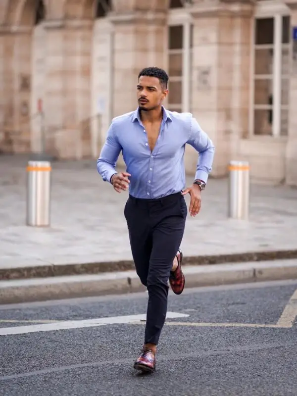 Free Photo  African man posed at street of city wear on blue shirt and  black pants