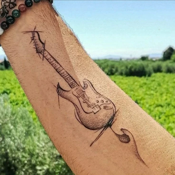 Music/Guitar Tattoo designs on hand for men