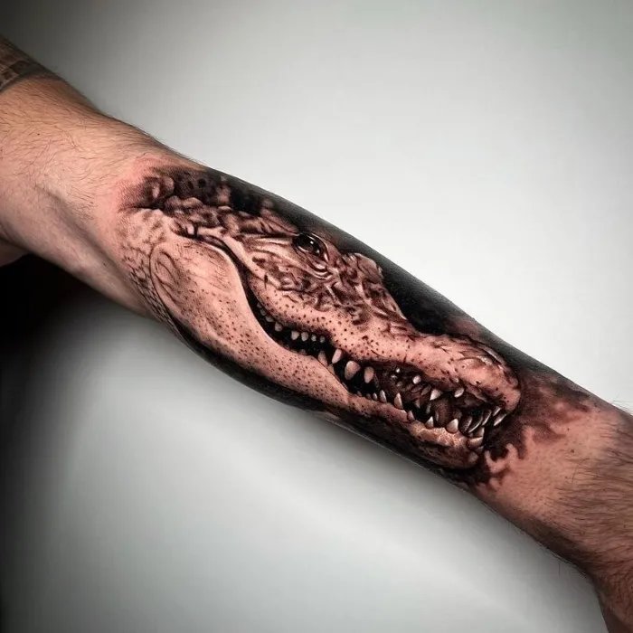 Crocodile tattoo on hand
