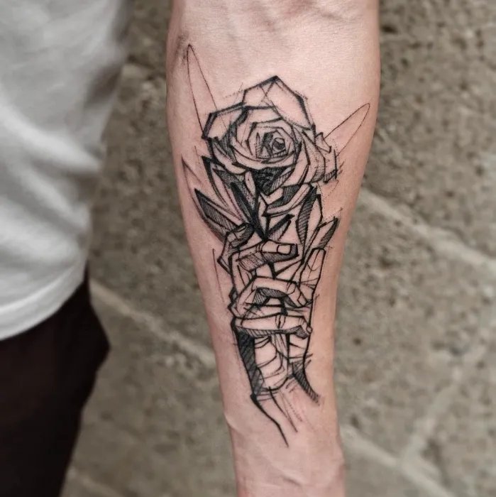 Artistic rose tattoo on hand