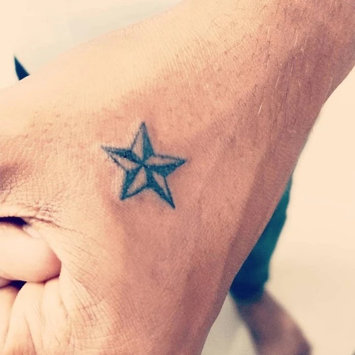 Small Nautical Star Tattoo on Hand