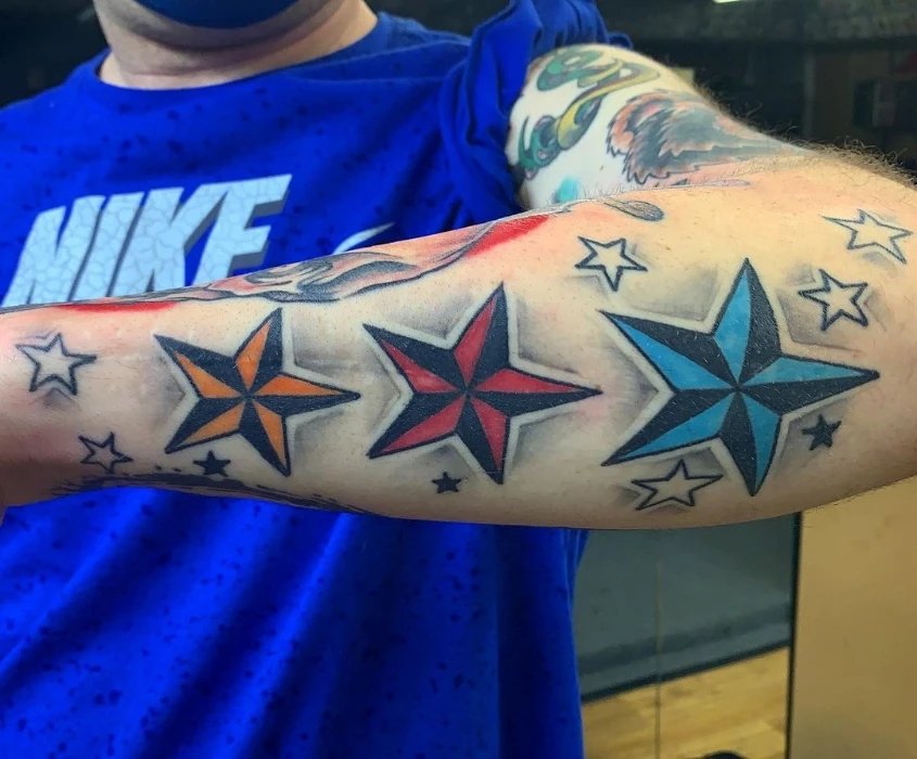 Colorful nautical star tattoo