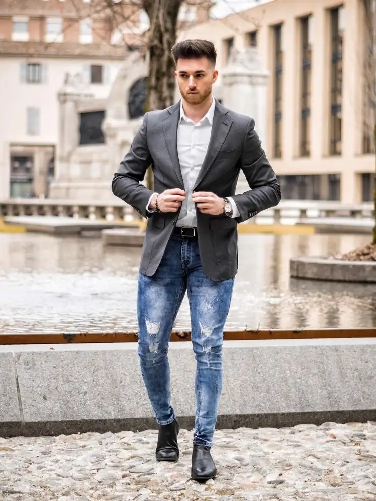 White shirt, blue jeans and grey blazers outfit combo 