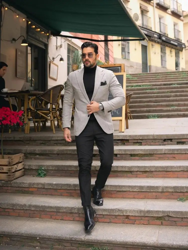 Black turtleneck, black trousers with grey blazer combination 