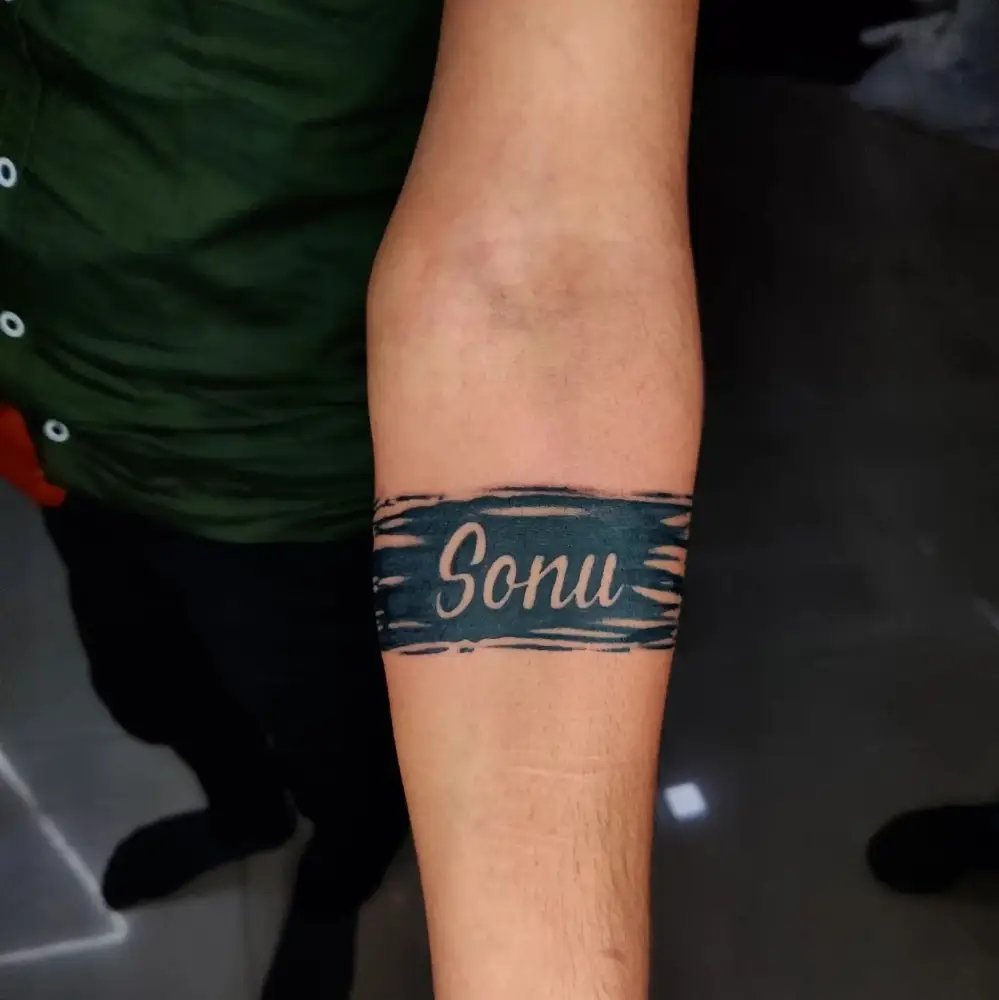 Name tattoo on Forearms Men