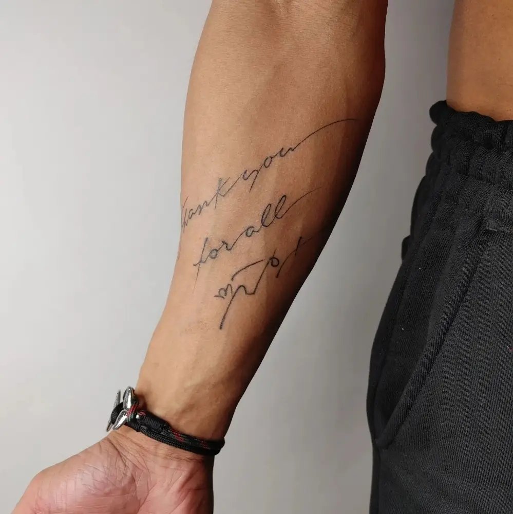 Name tattoo on Forearms Men