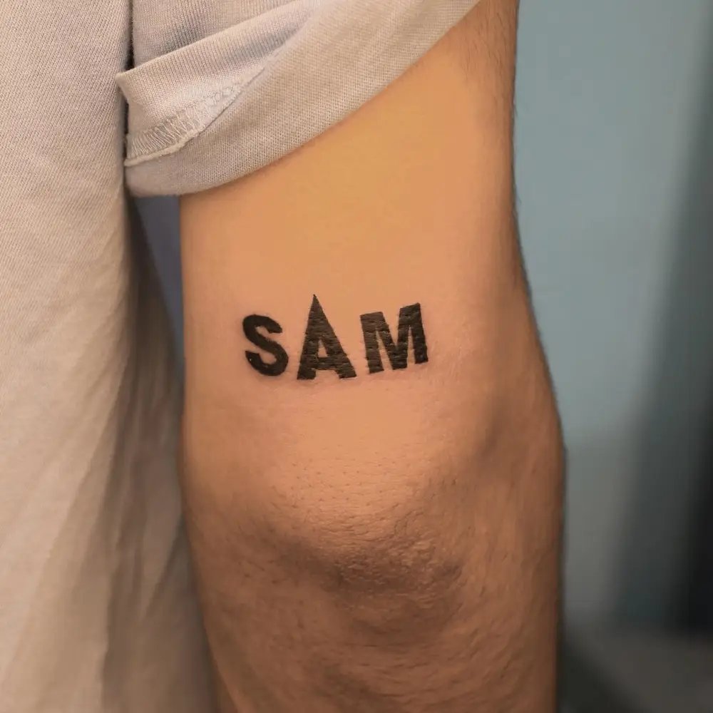 Name Tattoo Above Elbow Men