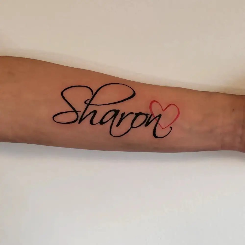 Name tattoo on Forearms Men