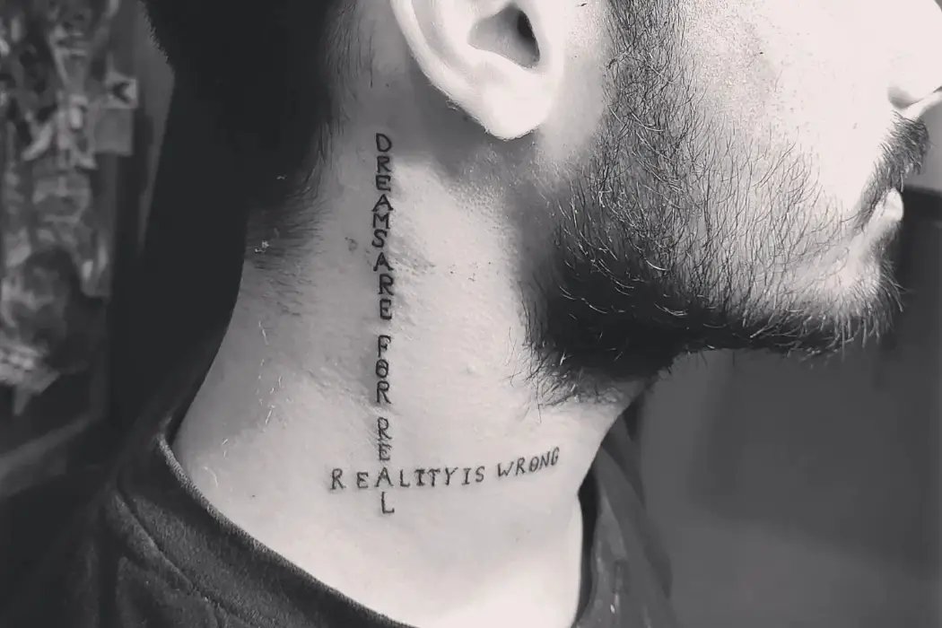 Stylish text tattoo on neck