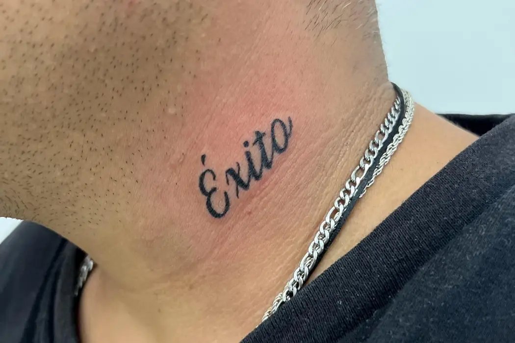 Exito, written text tattoo design on neck men