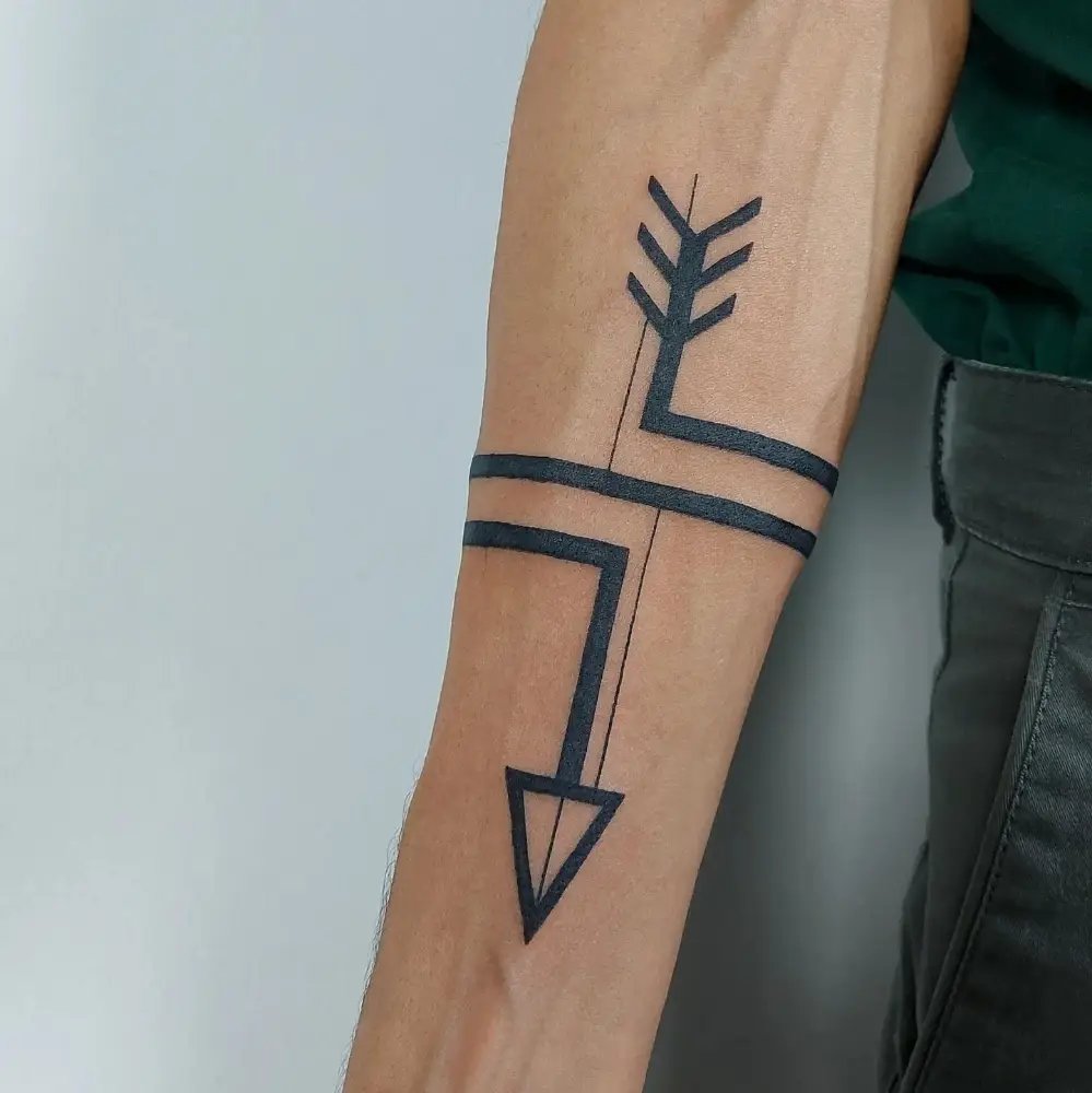 Arrow band tattoo on arm