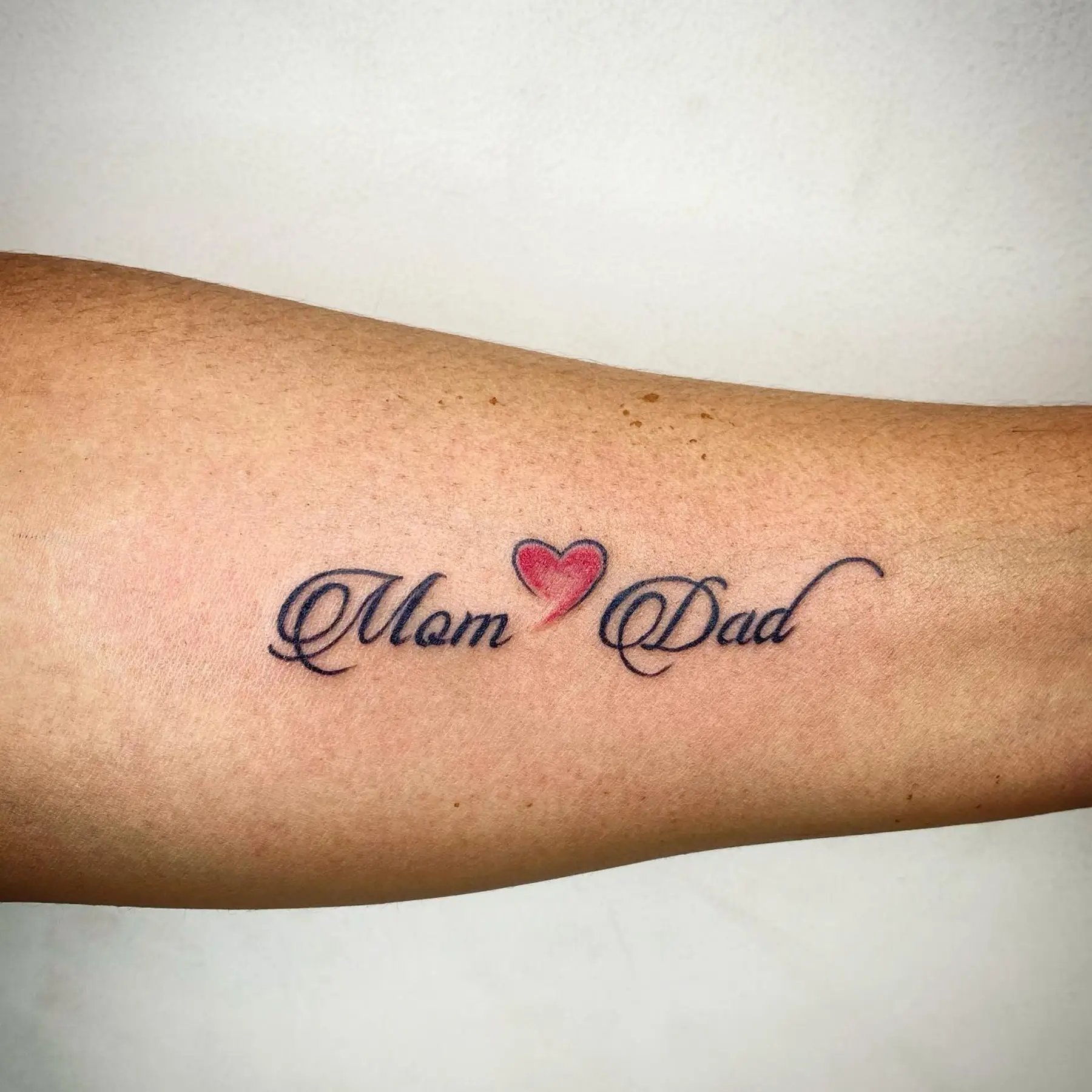 Mom dad tattoo inner forearms