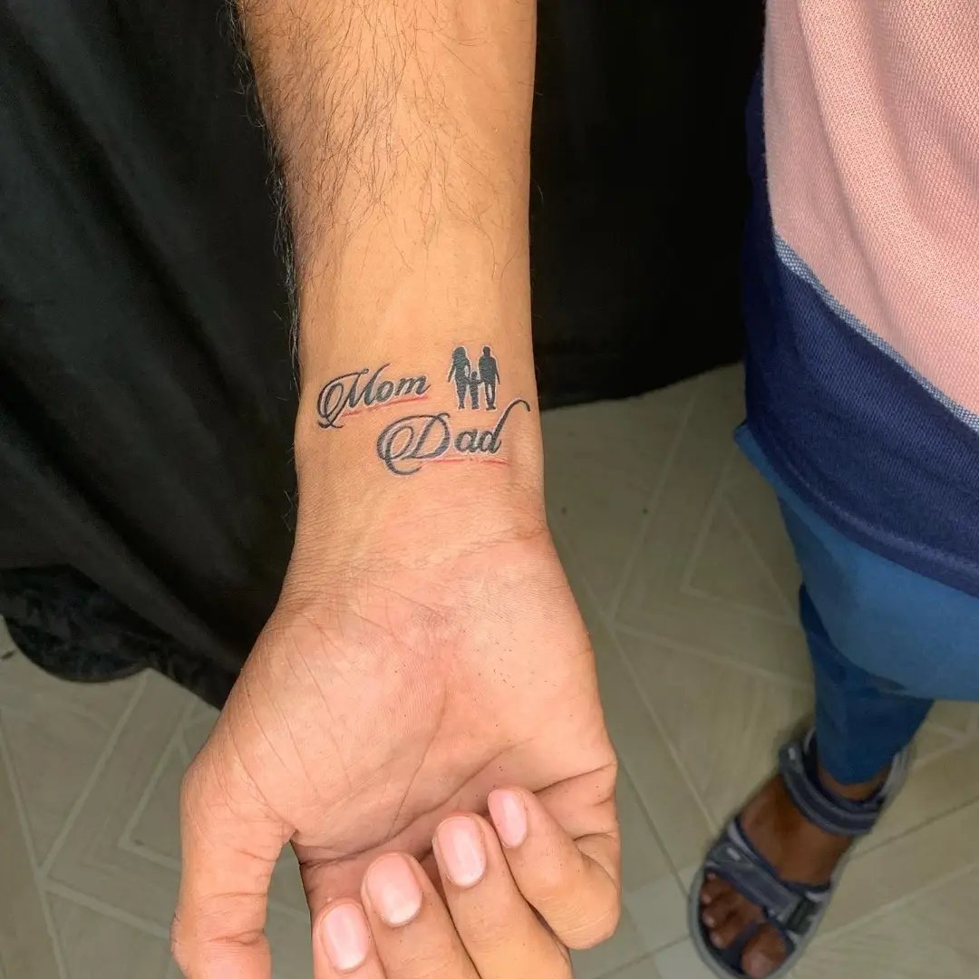 Small Mom Dad Tattoo on Hand

