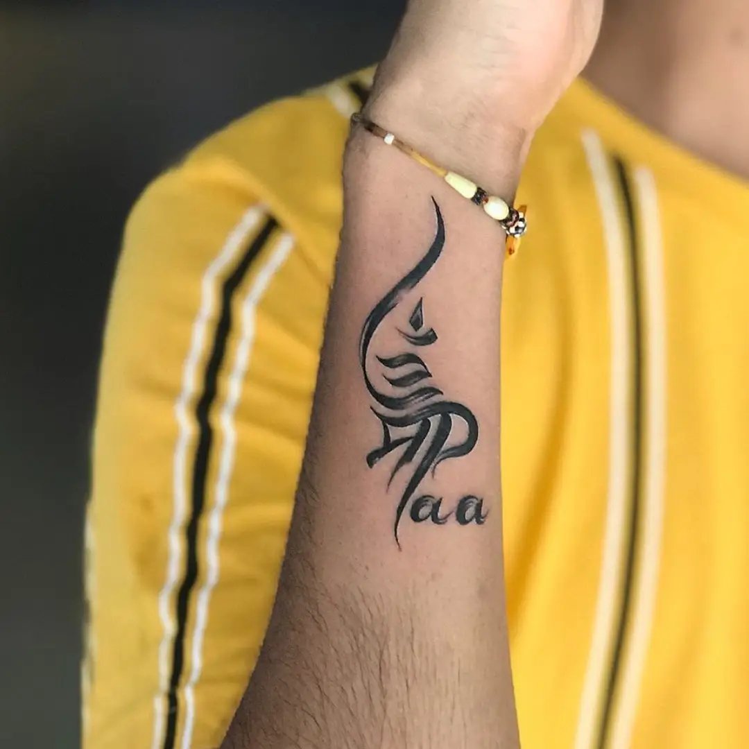 maa paa tattoo with om sign on hand