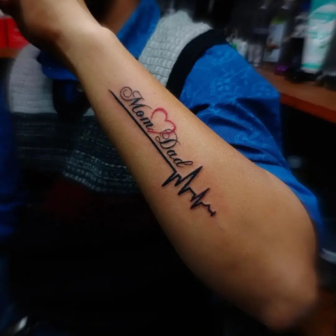 mom dad heartbeat side hand tattoo