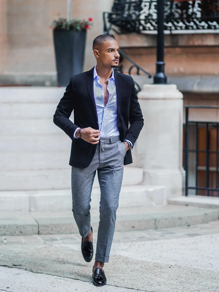 Black blazer with blue shirt and gray pants