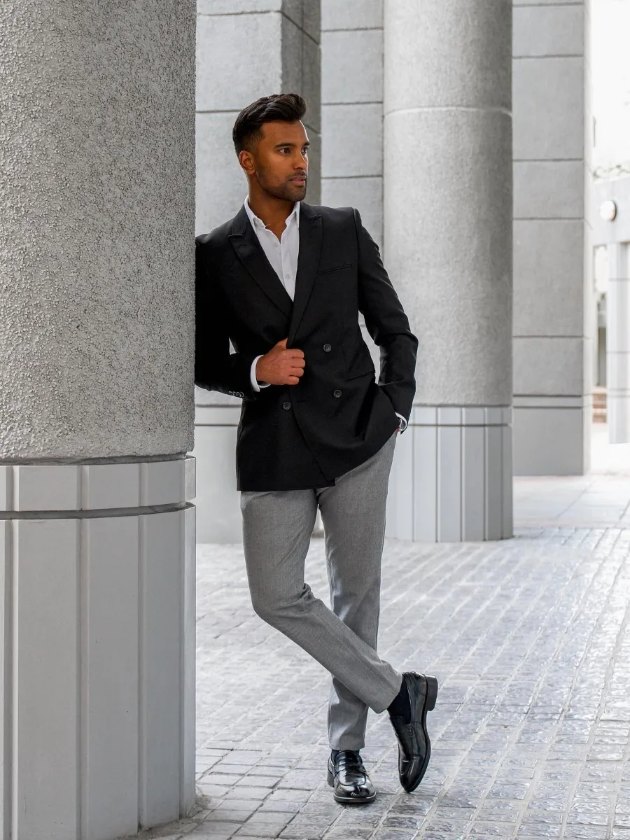 Black blazer with white shirt and gray pants