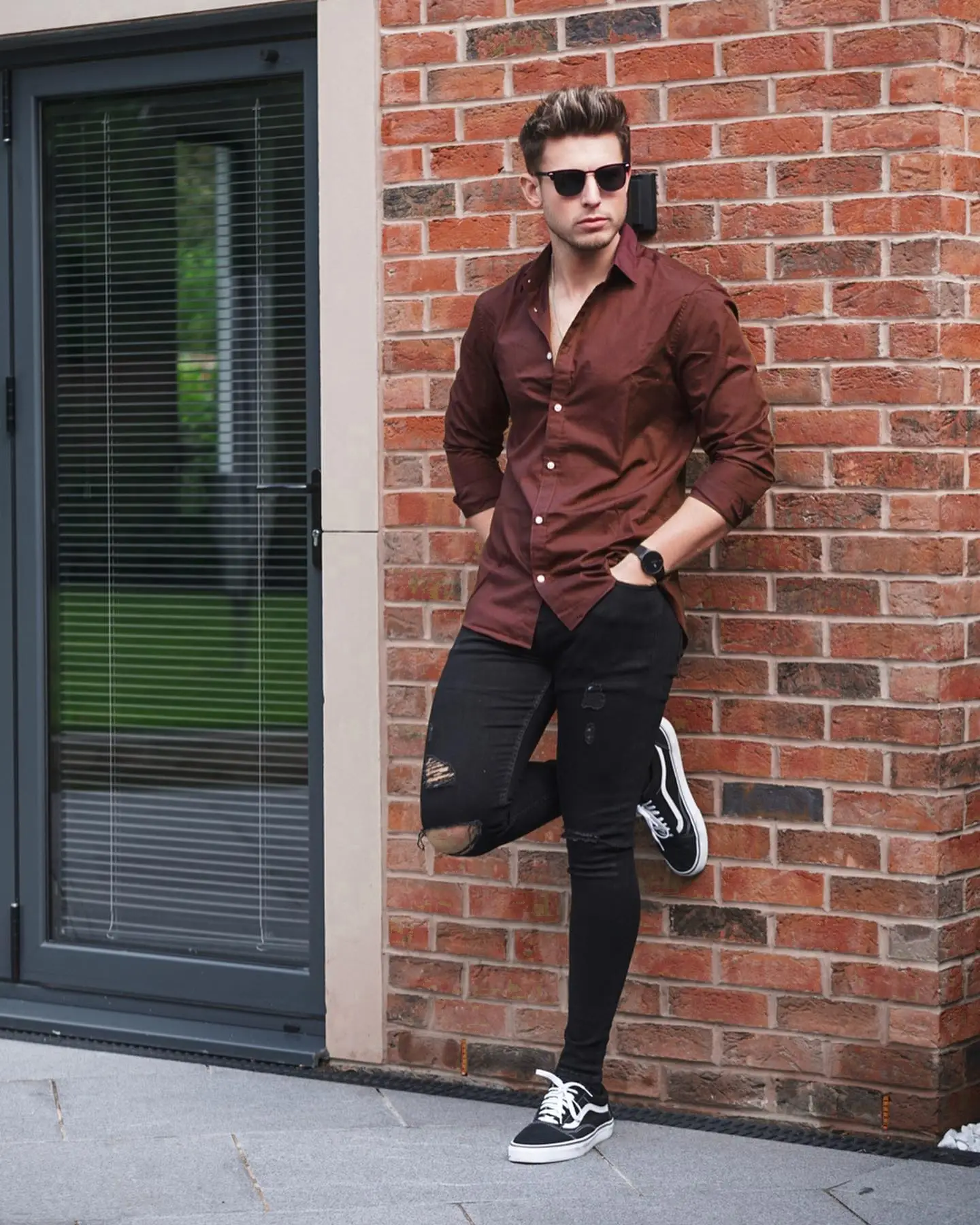 brown shirt with black pants