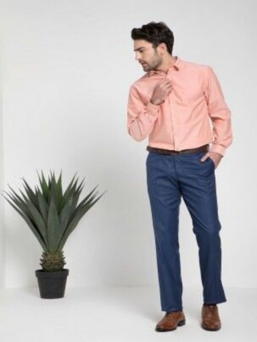 Peach color shirt with navy blue pants