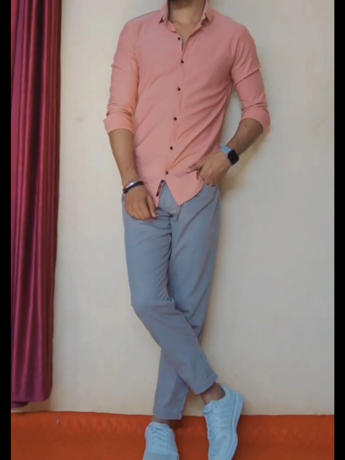 Peach colour shirt with light grey pants