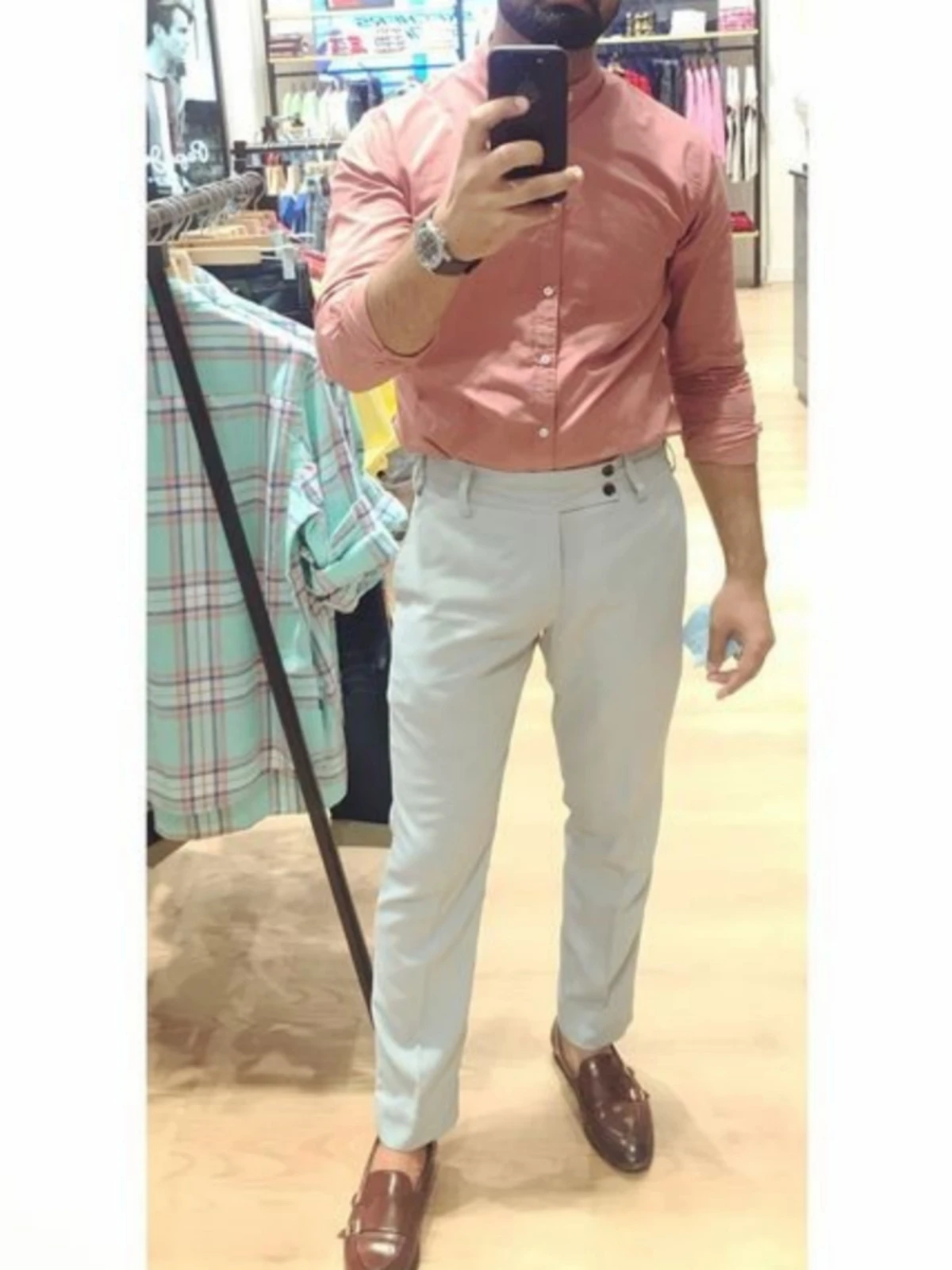 Peach colour shirt with light grey pants