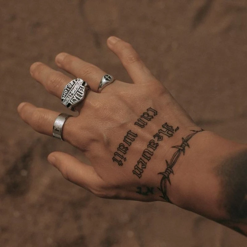 Text tattoo on hand men - 'heaven can wait'