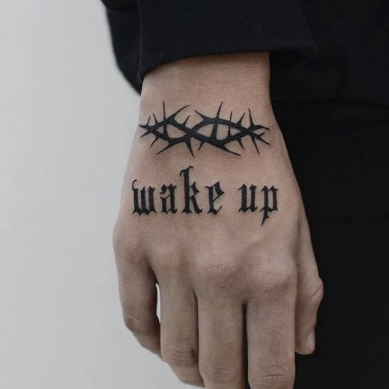 Text tattoo on hand men - wake up