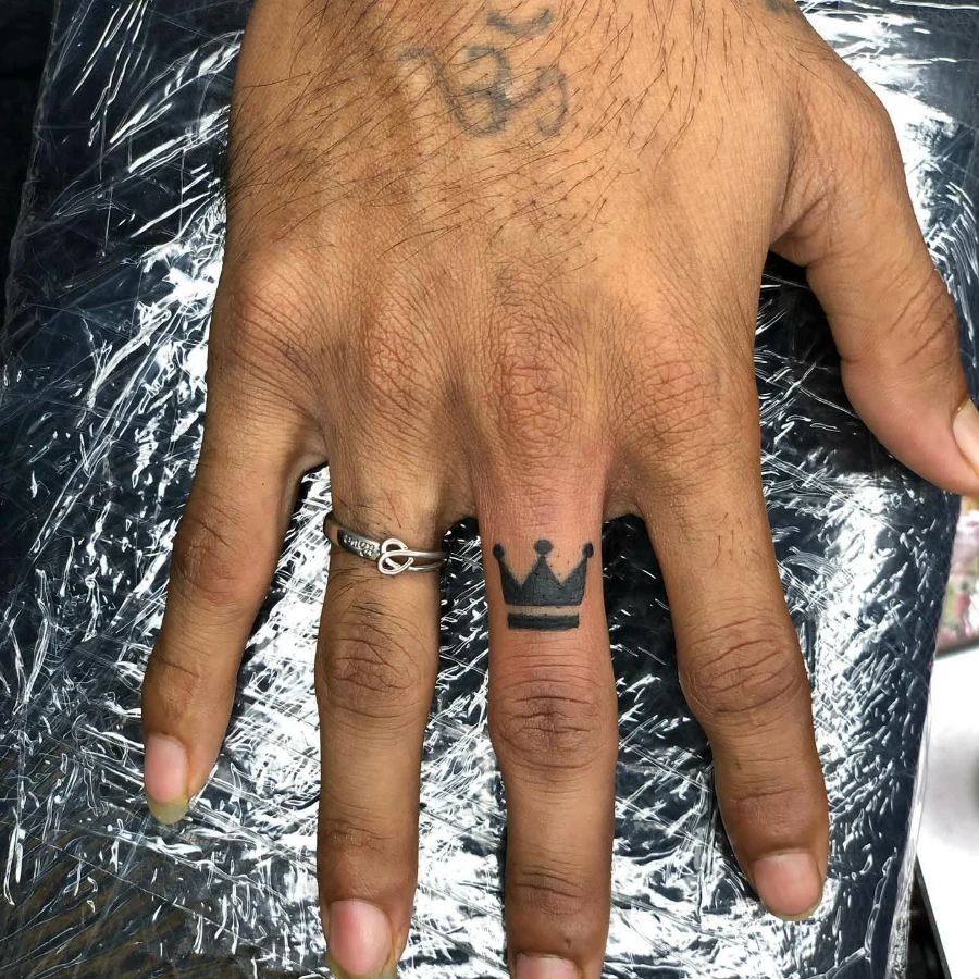 Crown Finger tattoo ideas for men