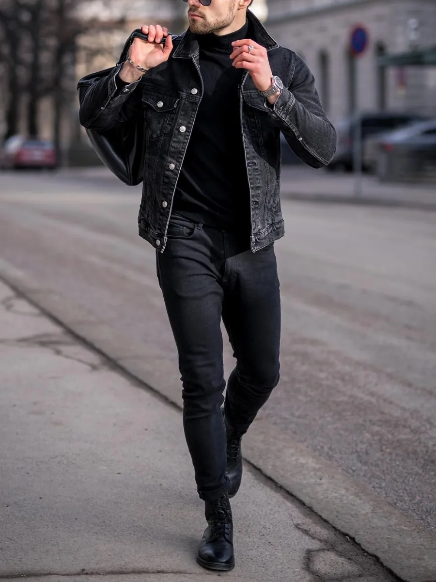 A man wearing black Turtleneck with black denim jacket and black jeans